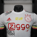 Camiseta hombre Ajax Bob Marley edición especial versión jugador temporada 2025 2026 calidad 1.1 oficial, Ajax Bob Marley 2025, Camiseta Ajax Three Little Birds, Camiseta Ajax jugador, Camiseta especial Ajax negra, Calidad 1.1 Ajax, Tienda Hincha Futbolero, Eredivisie 2026, Bloke Core Ajax, Regalo hombre Bob Marley, Jersey Ajax Marley authentic.