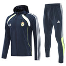 CHÁNDAL REAL MADRID CON CHAQUETA CORTAVIENTO Y PANTALÓN 25/26 HOMBRE