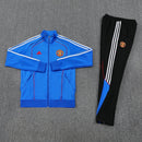 Chándal hombre Manchester United temporada 2025 2026 conjunto sudadera azul y pantalón largo negro calidad 1.1 premium oficial.