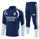 Conjunto hombre Real Madrid temporada 2026 2027 oficial sudadera azul marino pantalón largo fútbol técnica transpirable entrenamiento galáctico Bernabéu.