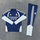 Conjunto hombre Real Madrid temporada 2026 2027 oficial sudadera azul marino pantalón largo fútbol técnica transpirable entrenamiento galáctico Bernabéu.