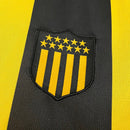 Camiseta hombre Peñarol temporada 2025 2026 primera equipación local listrada amarillo y negro escudo bordado calidad 1.1 oficial, Peñarol 2025, Camiseta Peñarol local, Peñarol 25/26, Camiseta Oro y Carbón, Camiseta barata Peñarol, Calidad 1.1 Uruguay, Fútbol Uruguayo 2026, Tienda Hincha Futbolero, Manya, Bloke Core Carbonero.