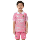 Conjunto infantil Real Madrid edición especial dragón 2025 2026 niños kit completo camiseta polo rosa y pantalón corto rosa oficial fútbol niños Madrid 25/26 exclusivo.