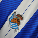 Real Sociedad 2026, Camiseta Real Sociedad oficial, Camiseta azul y blanca, Ropa oficial Txuri-Urdin, Camiseta fútbol San Sebastián, Regalo fútbol hombre Real Sociedad, Camiseta Reale Arena, Jersey Erreala 25/26, Bloke Core kit, Comprar camiseta barata, Tienda Hincha Futbolero.