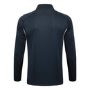 Sudadera hombre Real Madrid temporada 2025 2026 color gris oscuro oficial fútbol merengue técnica transpirable entrenamiento urbana antracita.